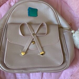Elegant Cream Backpack with Bow Accent